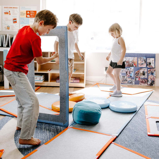 K-6 students building a whole-body learning structure in the classroom.